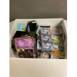 A selection of collectable Pokemon cards and associated Pokemon collectables and advertising