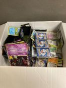 A selection of collectable Pokemon cards and associated Pokemon collectables and advertising