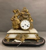 A French eight day gilt clock with enamel face on a marble base