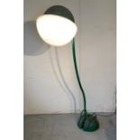 A Mid Century floor lamp "Locus Solus" by Gae Aulenti, green painted tubular steel with cast iron