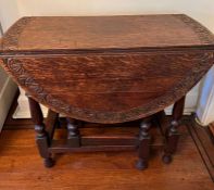 A small gate leg breakfast table with carved rim (H75cm W83cm D41cm)