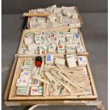 A quantity of1920's ceramic mahjong pieces made in England by Hickson along with some bone and