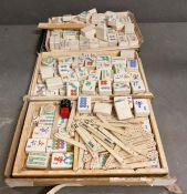 A quantity of1920's ceramic mahjong pieces made in England by Hickson along with some bone and