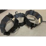 Three metal collars with loops and some with hooks
