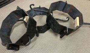 Three metal collars with loops and some with hooks