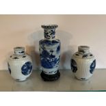 Three blue and white porcelain vases and lidded ginger jars