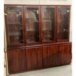 A rosewood four cupboard display cabinet, four cupboards below and four glazed cupboards above (