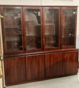 A rosewood four cupboard display cabinet, four cupboards below and four glazed cupboards above (