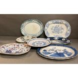 A varied selection of meat platters and serving dishes, various ages and makers