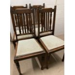 A set of four oak dining chairs on turned front legs