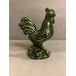 A glazed figure of a cockerel