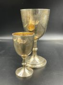 Two silver cups, not engraved, hallmarked for Birmingham and Chester (17 cm and 11cm h Approximate