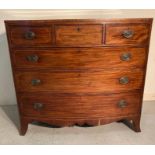 A mahogany three over three chest of drawers with brass drop handles (H102cm W112cm D56cm)