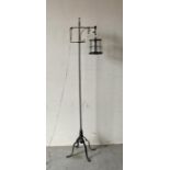 A wrought iron Mid Century floor lamp, gibbet style shade (H152cm)