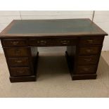 A mahogany pedestal desk with green leather top (H70cm W122cm D65cm)