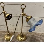 A pair of brass lamp with petal detail base