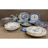 A large collection of blue and white china to include warmers dinner plates and dishes, various