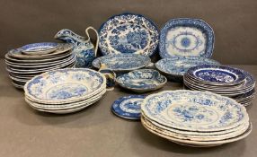 A large collection of blue and white china to include warmers dinner plates and dishes, various