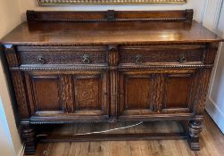 An oak sideboard (H110cm W153cm D56cm)