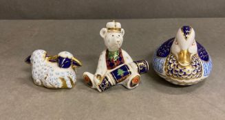Three Crown Derby figures: Duck, Pair of Lambs, Polar Bear with cracker