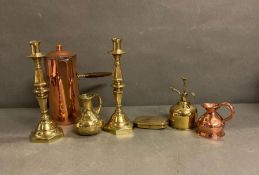A selection of metal ware to include candlesticks, small copper jug etc