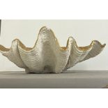 A giant faux clam shell inside gilded painted (H18cm W64cm D39cm)