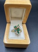 An 18ct gold and emerald and diamond ring