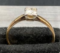 A single diamond ring (4mm diameter approximately) on an 18ct yellow gold setting size M