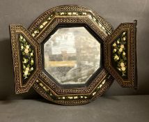 An octagonal Persian mirror with hand painted front