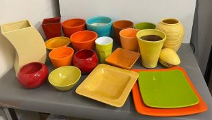 A vibrant selection of glazed pots, plates and vases