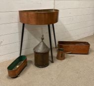 A selection of vintage copper items to include a planter on tripod legs, two window planters on lion