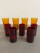 Nine coloured glasses or candle holders