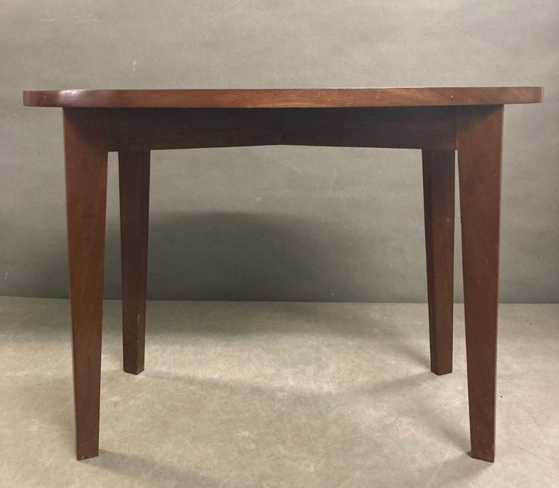 A small oval mahogany side table