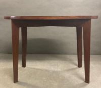 A small oval mahogany side table