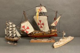 Three wooden model boats