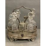 A cut glass and silver plated cruet set