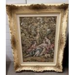 A tapestry of a classical scene in a Louis style frame