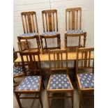 A dining table and chairs, various styles, slat backs and peg end tables (H75cm W170cm D79cm)