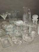 A selection of glassware including crystal glass jugs, ice buckets, decanters and candlestick