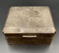 A small silver cigarette box, machine tooled