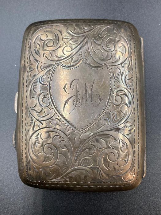 A silver cigarette case, hallmarked for Birmingham.