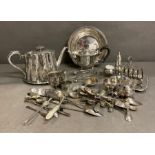 A large selection of silver plate items to include tea set, Harrods bowl, toast rack, cutlery etc.