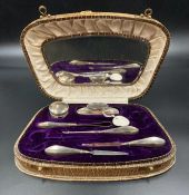 A part cased silver handled vanity set by Crisford & Norris Ltd, hallmarked for Birmingham.