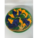 An emerald blue and orange charger plate. Signed to base (Dia39cm)