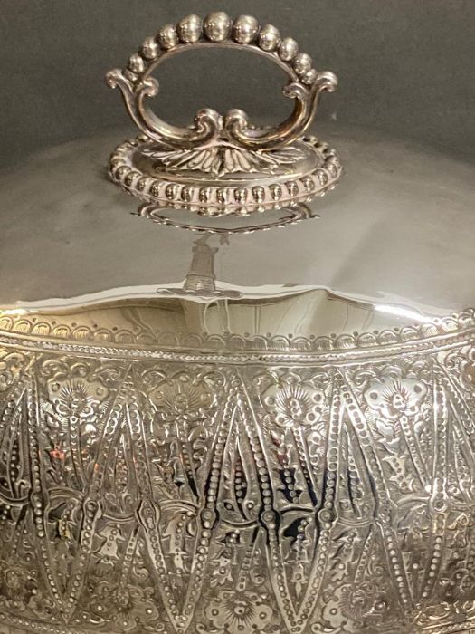 A set of three graduated silver plated dining domes with chased decoration and armorial to top by - Image 3 of 6