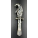 A silver and Mother of Pearl rattle in the form of Punch