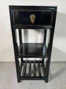 A black lacquer three tier stand (H92cm W40cm D38cm)
