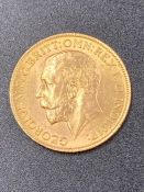 A 1913 Sovereign coin.