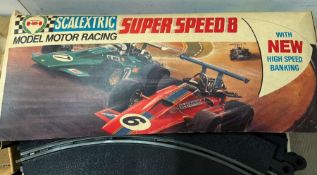 A vintage scalextric track, control and cars