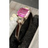 An 18ct, white gold set ring with central pink stone with diamond shoulders, size Q